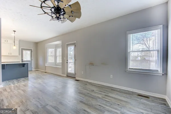 a view of an empty room with a window