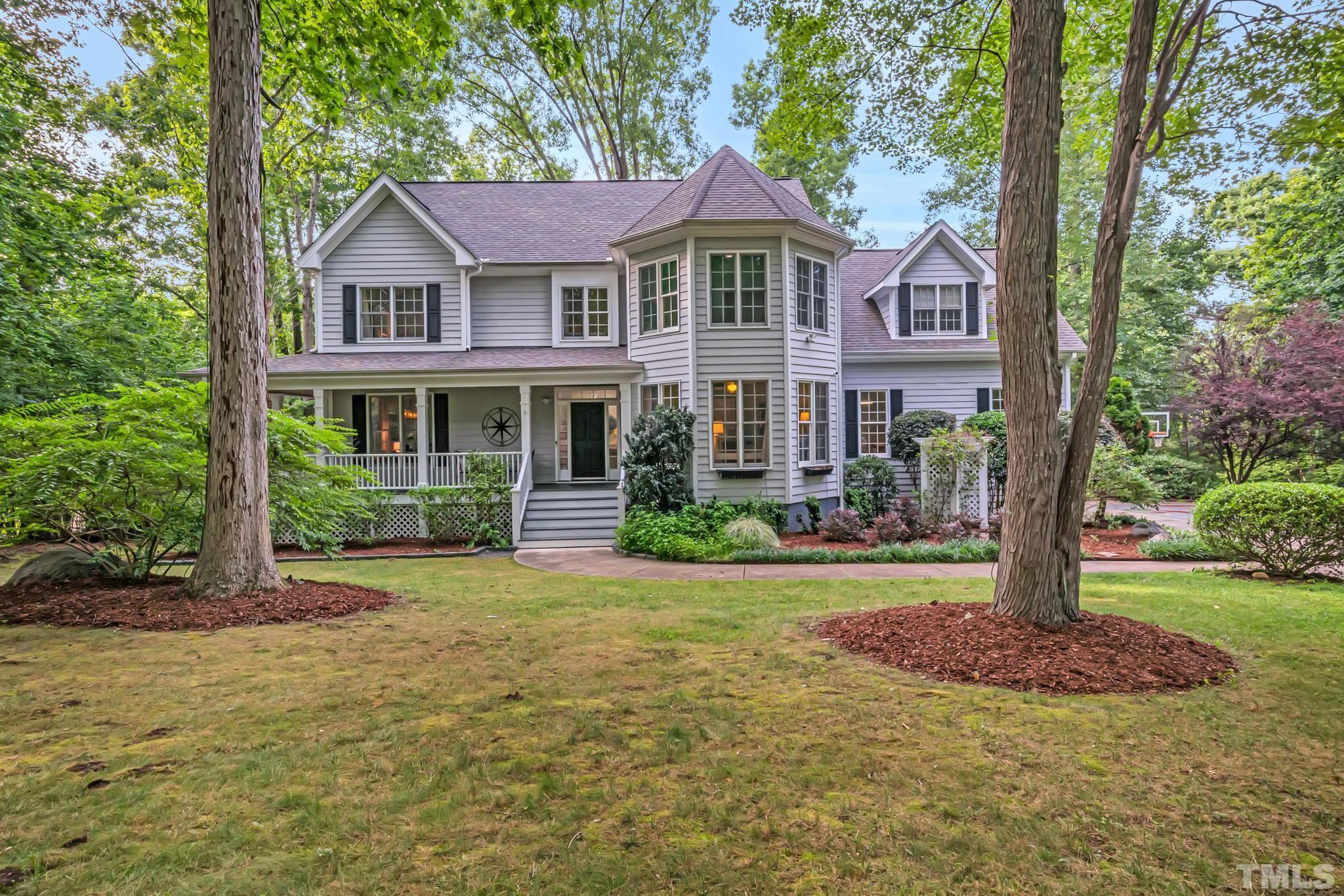 119 Fawn Ridge Road Chapel Hill, NC 27516 - Photo 1 of 98 a front view of a house with a yard and trees
