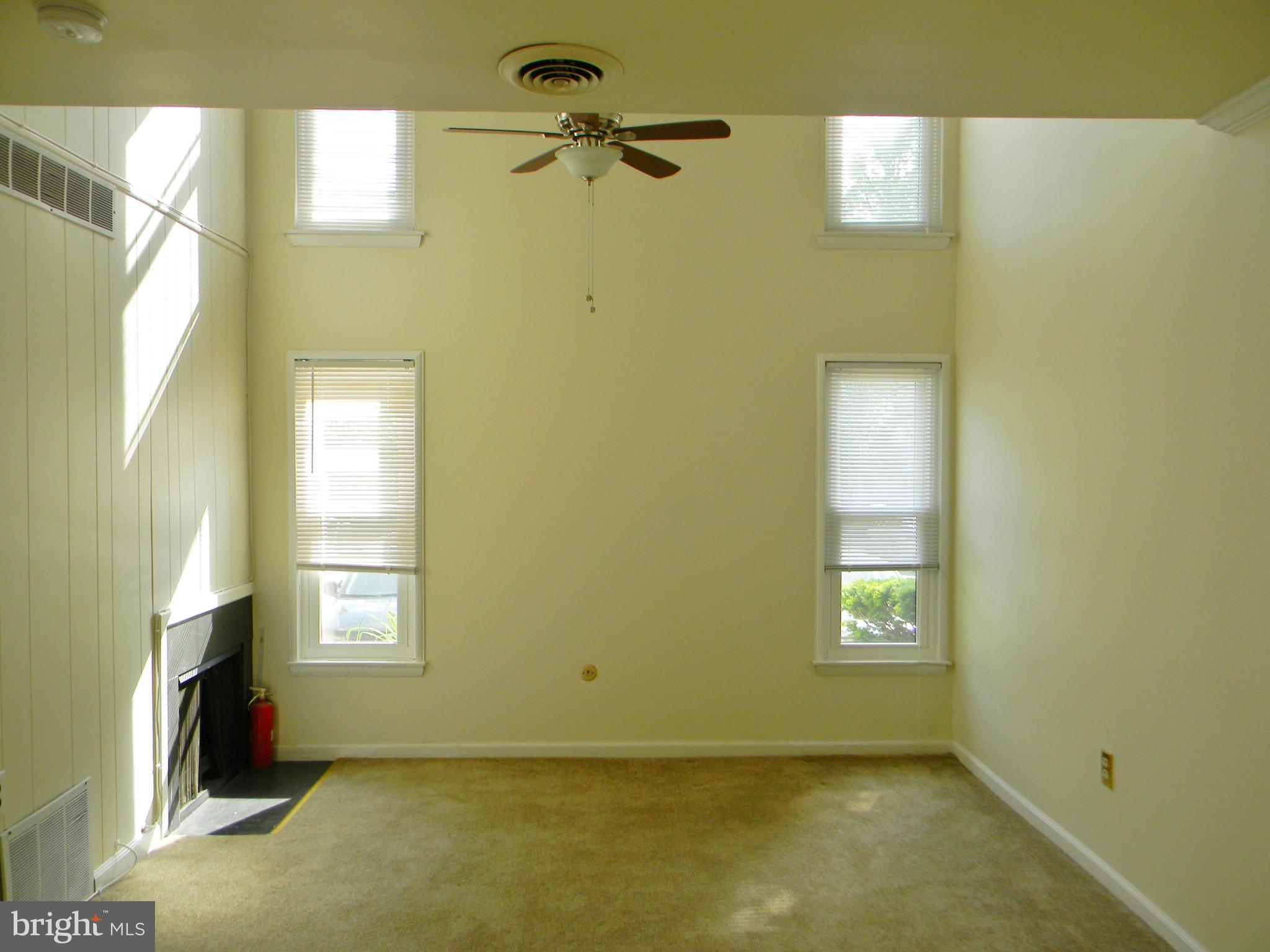 3604 San Rafael Court, Unit TYPE Springfield, PA 19064 - Photo 11 of 36 Two Story Den with Ceiling Fan