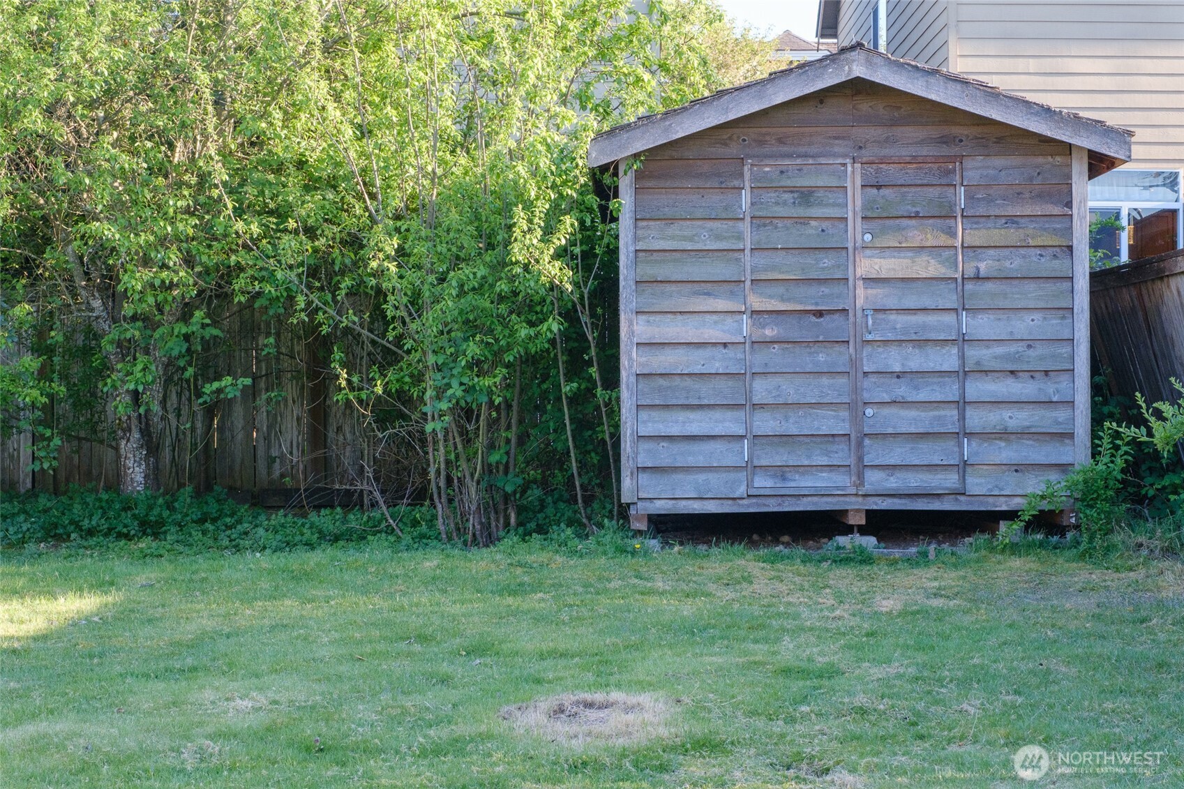 830 234th Street Southeast Bothell, WA 98021 - Photo 25 of 26 a view of a backyard with potted plants