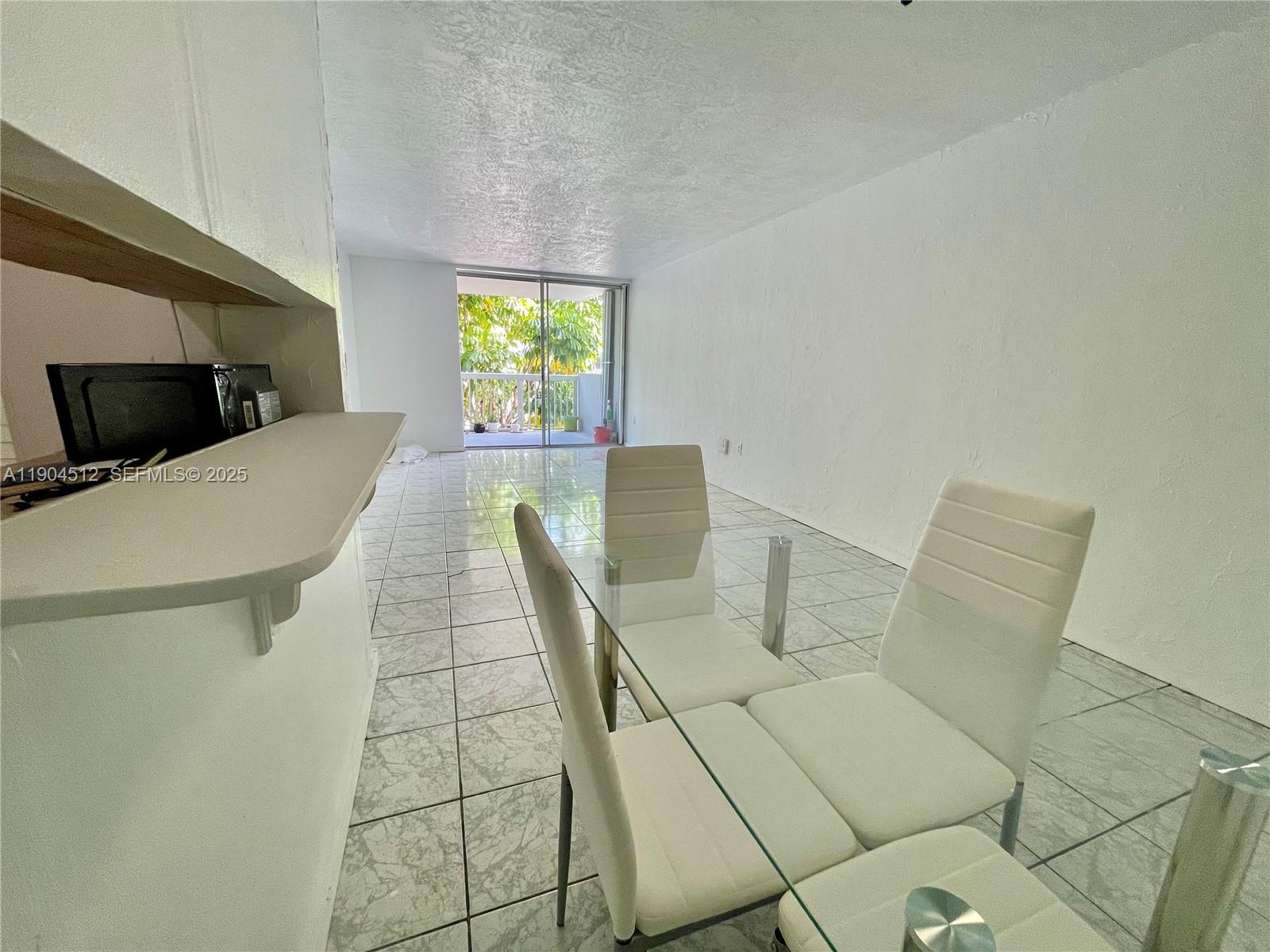 1670 Bay Road, Unit 2B Miami Beach, FL 33139 - Photo 8 of 15 a living room with furniture