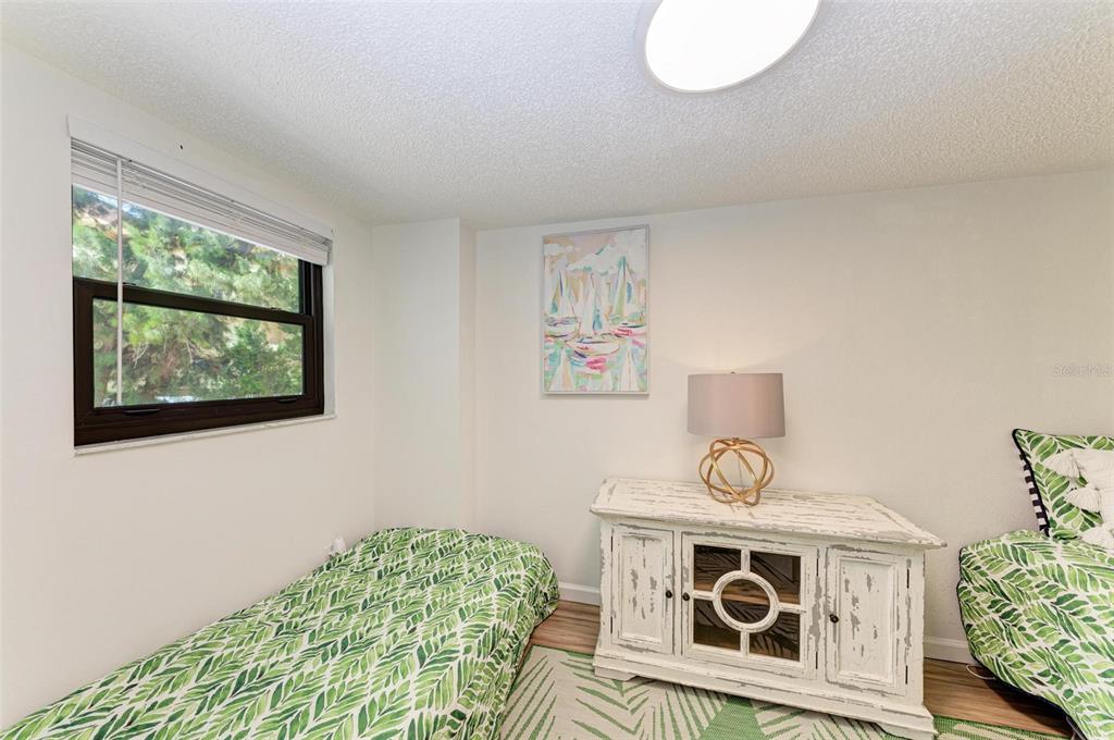 8735 Midnight Pass Road, Unit 107B Sarasota, FL 34242 - Photo 36 of 55 a view of dining room with wooden floor