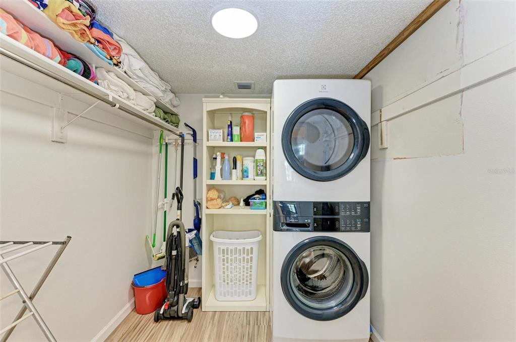 8735 Midnight Pass Road, Unit 107B Sarasota, FL 34242 - Photo 39 of 55 a utility room with dryer and washer