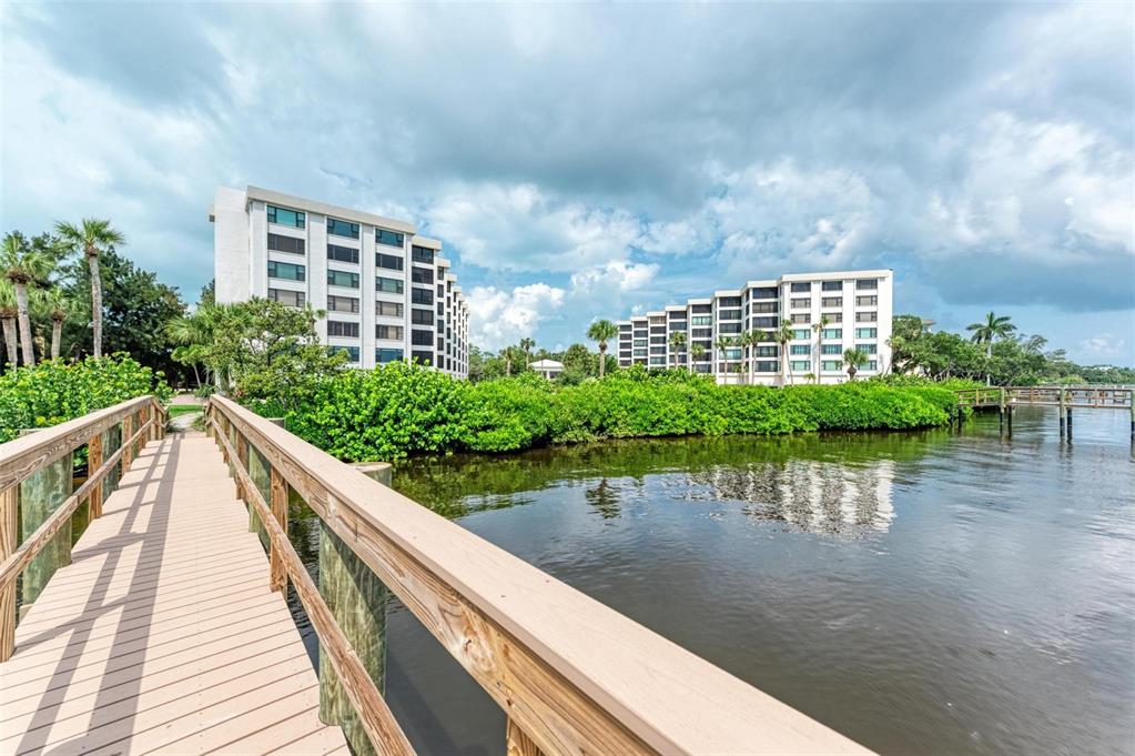8735 Midnight Pass Road, Unit 107B Sarasota, FL 34242 - Photo 42 of 55 a view of a balcony with sitting area