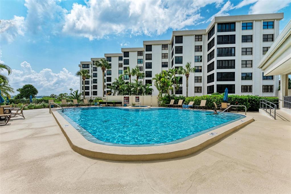 8735 Midnight Pass Road, Unit 107B Sarasota, FL 34242 - Photo 45 of 55 a view of a building with a garden