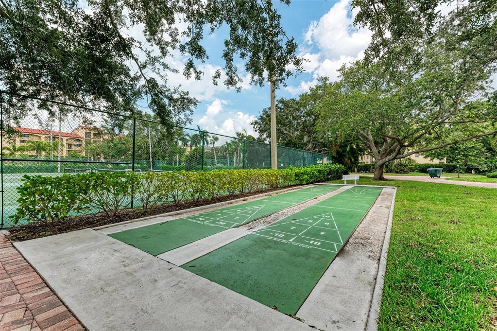 8735 Midnight Pass Road, Unit 107B Sarasota, FL 34242 - Photo 49 of 55 a view of a park with large trees