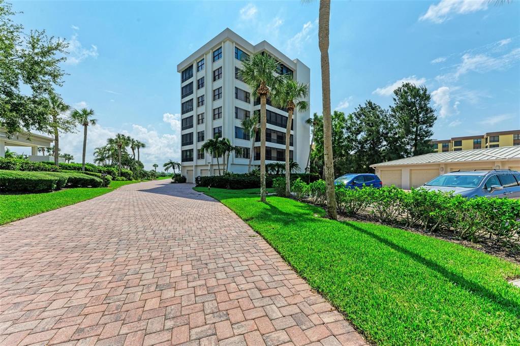 8735 Midnight Pass Road, Unit 107B Sarasota, FL 34242 - Photo 6 of 55 a view of a building with a yard
