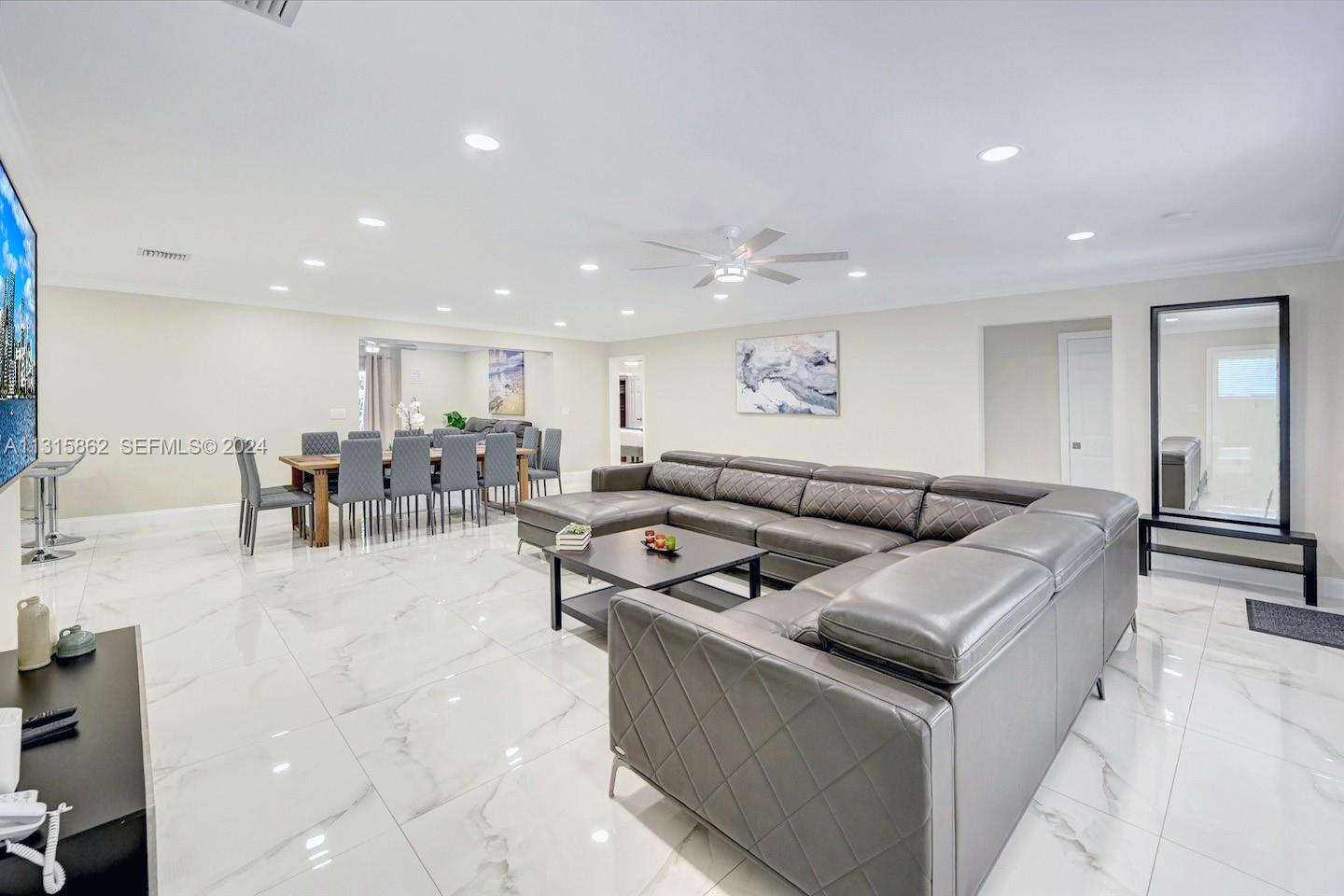 1307 Rodman Street Hollywood, FL 33019 - Photo 11 of 38 a living room with furniture and a table