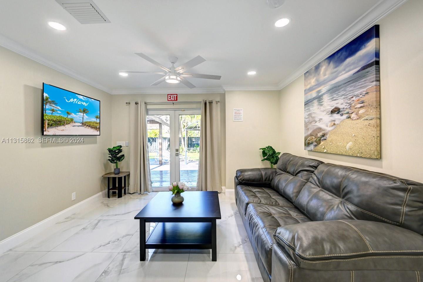 1307 Rodman Street Hollywood, FL 33019 - Photo 12 of 38 a living room with furniture and a large window