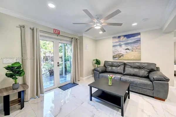 a living room with furniture and a large window