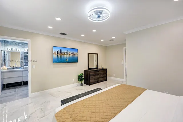 a bedroom with a bed and a couch