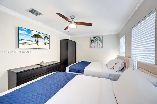 a bedroom with furniture and wooden floor