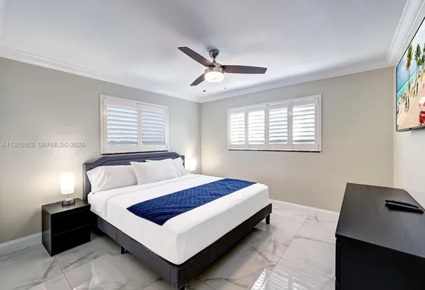 a bedroom with a bed and window