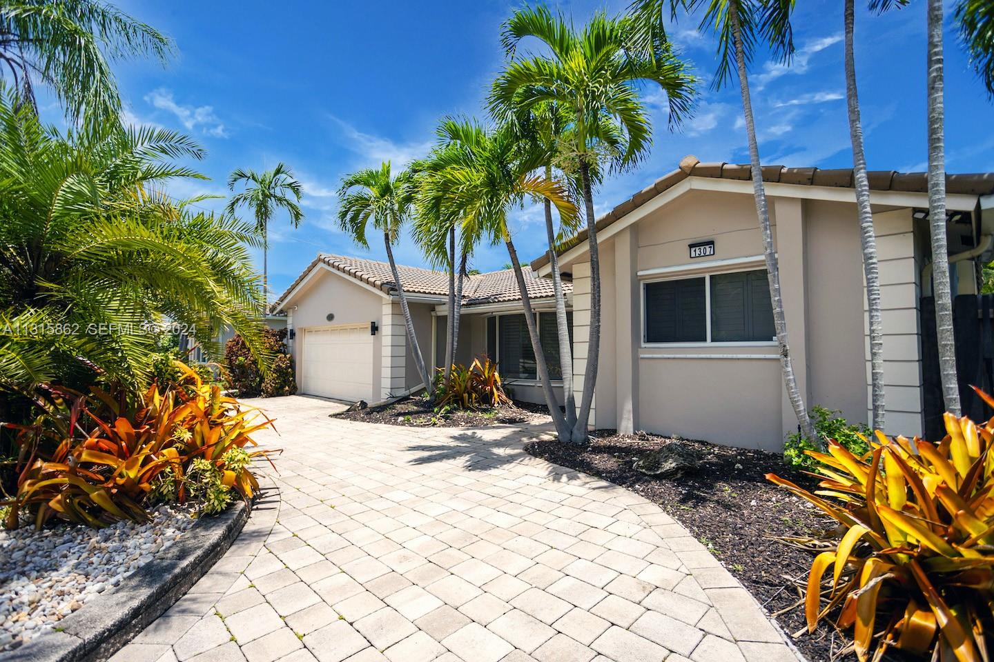 1307 Rodman Street Hollywood, FL 33019 - Photo 7 of 38 a front view of a house with a yard