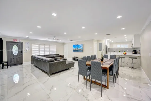 a kitchen with a table and chairs in it