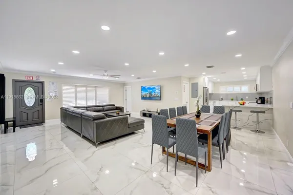 a kitchen with a table and chairs in it