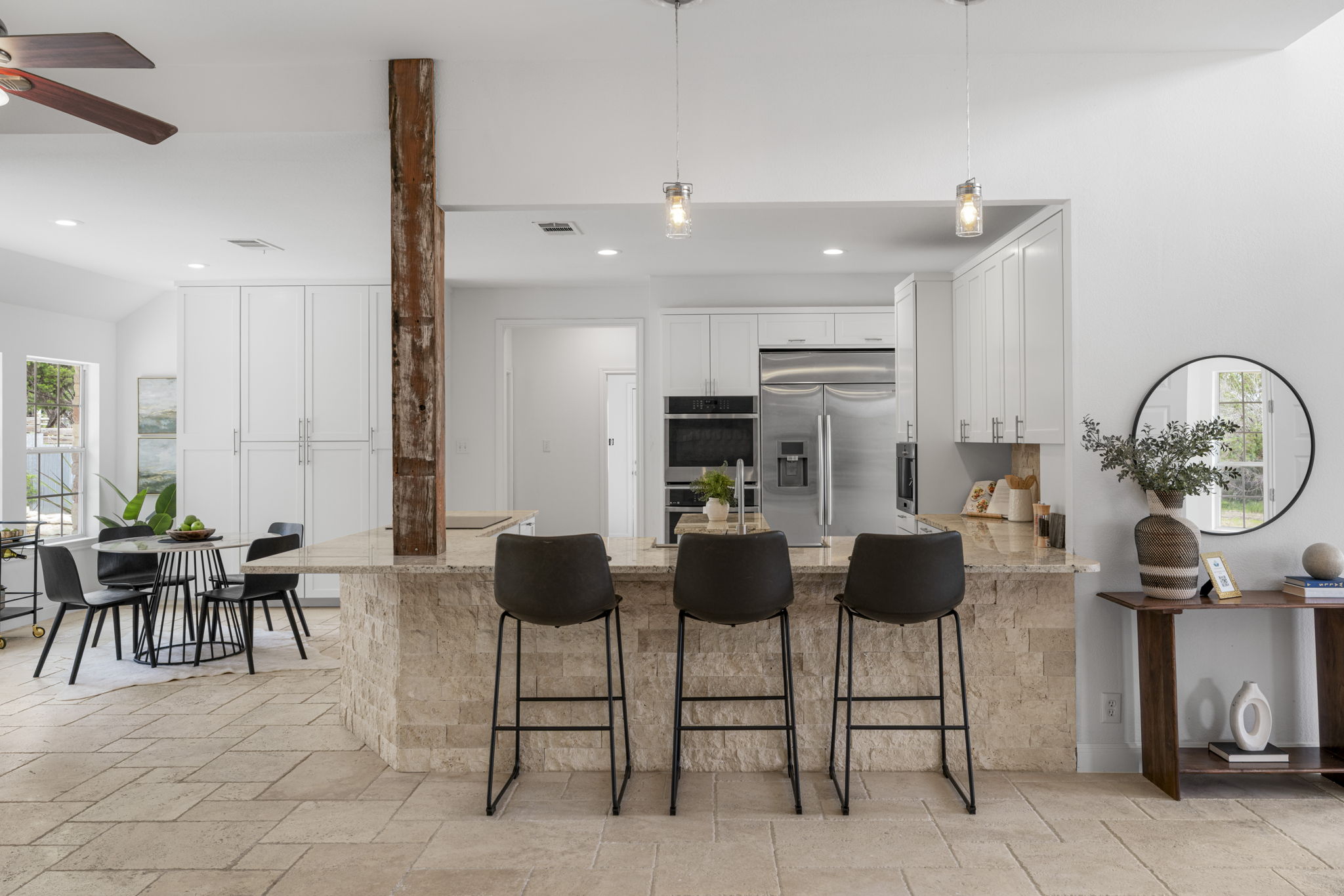 1129 Cedar Pass Road Driftwood, TX 78619 - Photo 9 of 40 I can just imagine guests hanging out at the breakfast bar while you’re prepping dinner. It’s a very social layout that feels sophisticated but still incredibly comfortable.