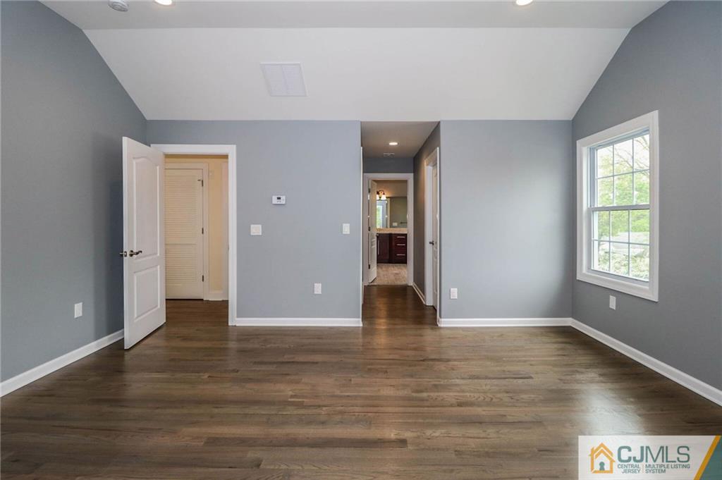 23 Windsor Road Edison, NJ 08817 - Photo 20 of 25 wooden floor in an empty room with a window