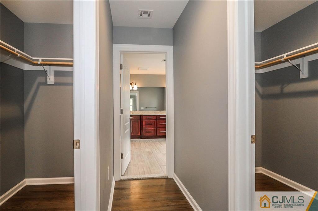 23 Windsor Road Edison, NJ 08817 - Photo 22 of 25 a view of a hallway with wooden floor and a bathroom