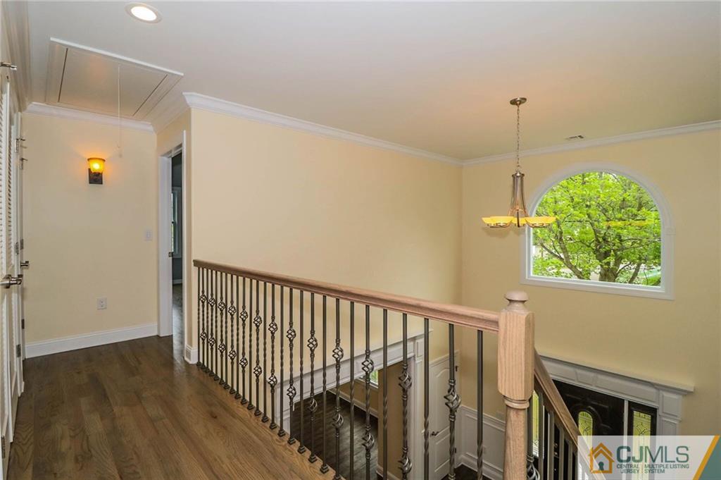 23 Windsor Road Edison, NJ 08817 - Photo 23 of 25 a view of a hallway with wooden floor and entryway