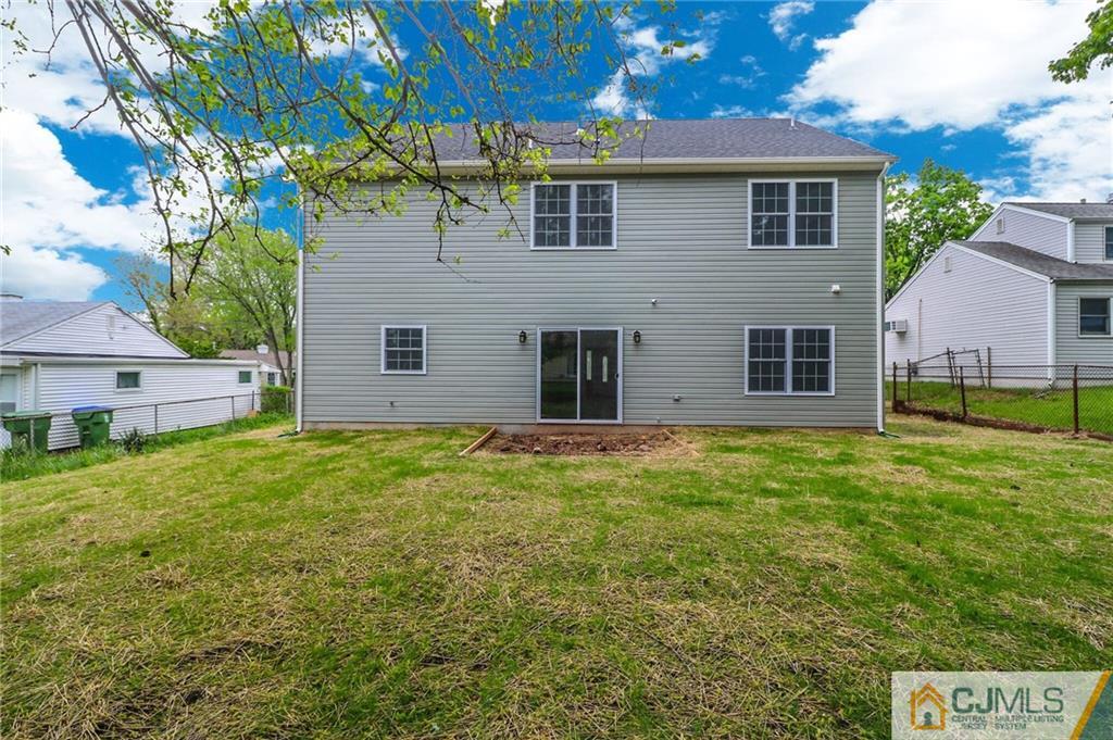23 Windsor Road Edison, NJ 08817 - Photo 24 of 25 a view of a house with a backyard