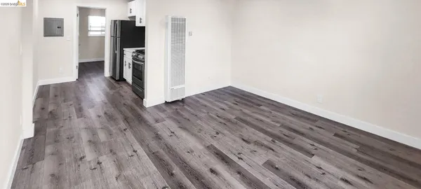 a view of a kitchen from the hallway