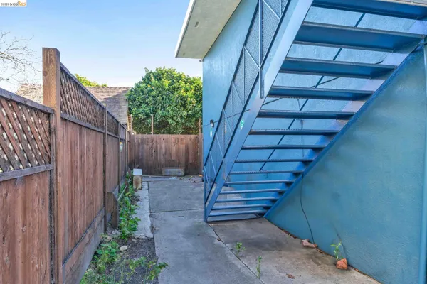 a view of a brick house with many windows