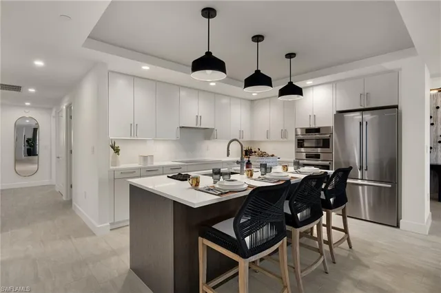 a bathroom with a double vanity sink mirror and shower