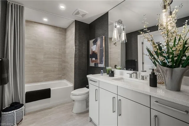 a view of house with swimming pool and outdoor seating