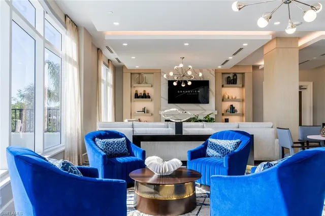 a bedroom with a large bed and a couch