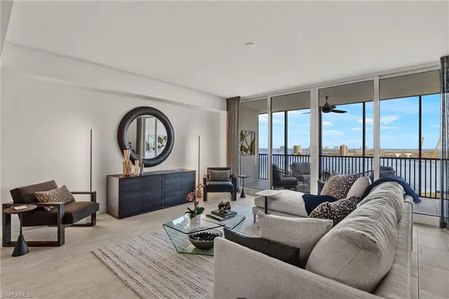 a living room with a bed furniture and a window