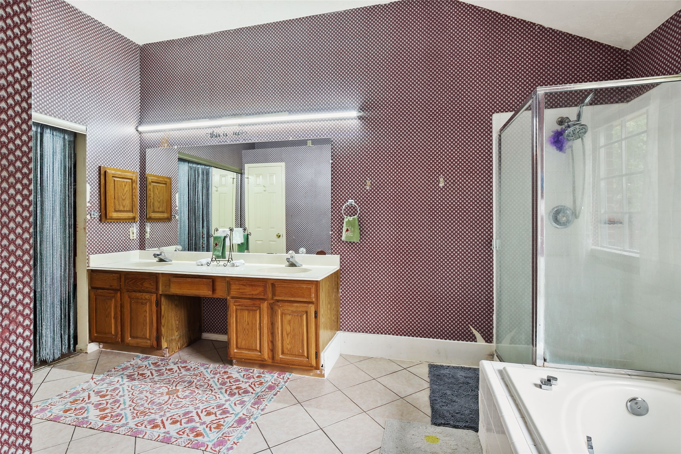 14554 Sycamore Lake Road Houston, TX 77062 - Photo 11 of 17 a spacious bathroom with a tub sink and mirror