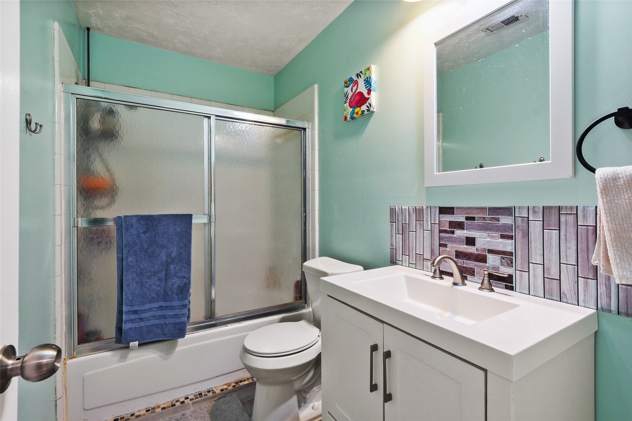 14554 Sycamore Lake Road Houston, TX 77062 - Photo 16 of 17 a bathroom with a sink vanity mirror and toilet