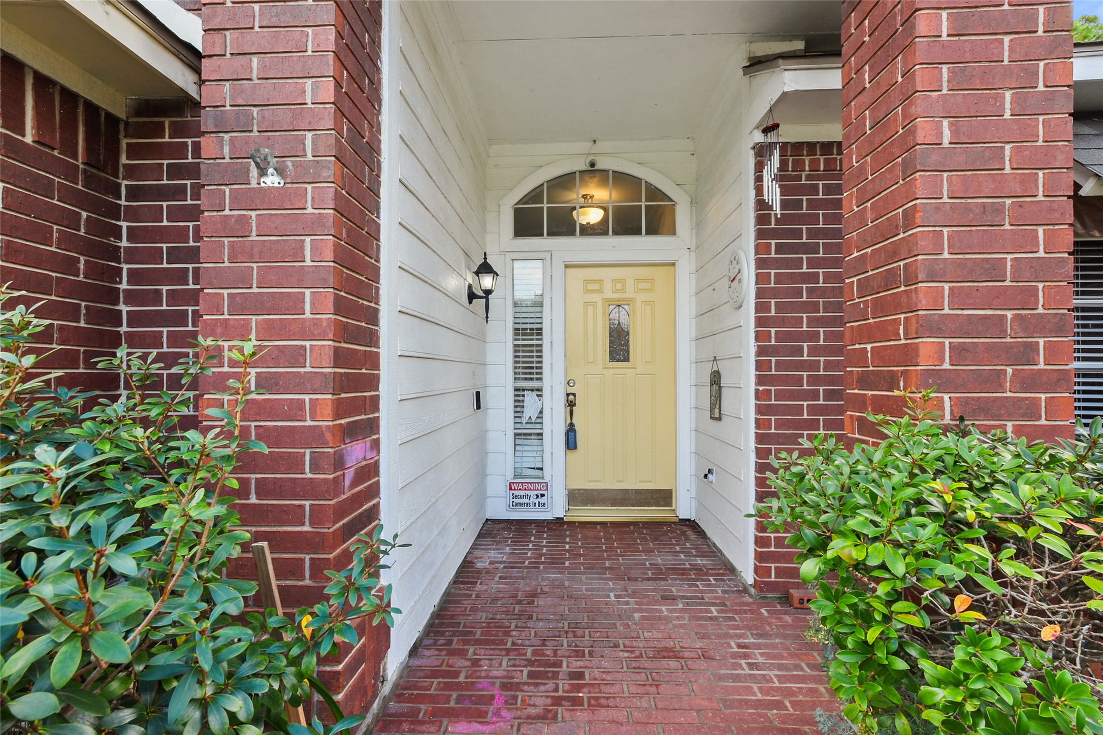 14554 Sycamore Lake Road Houston, TX 77062 - Photo 3 of 17 a view of a brick wall of the building and front door