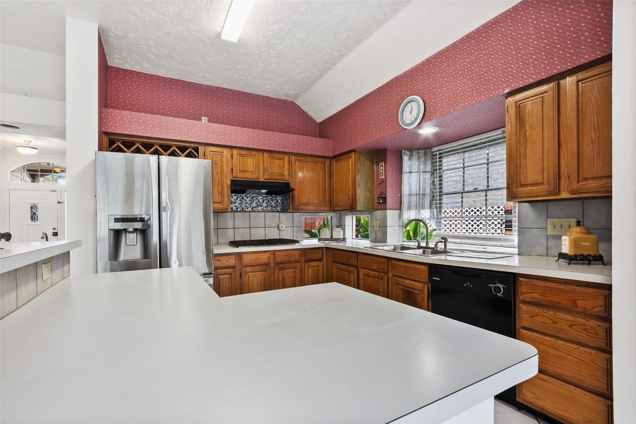 14554 Sycamore Lake Road Houston, TX 77062 - Photo 7 of 17 a kitchen with granite countertop a sink cabinets and stainless steel appliances