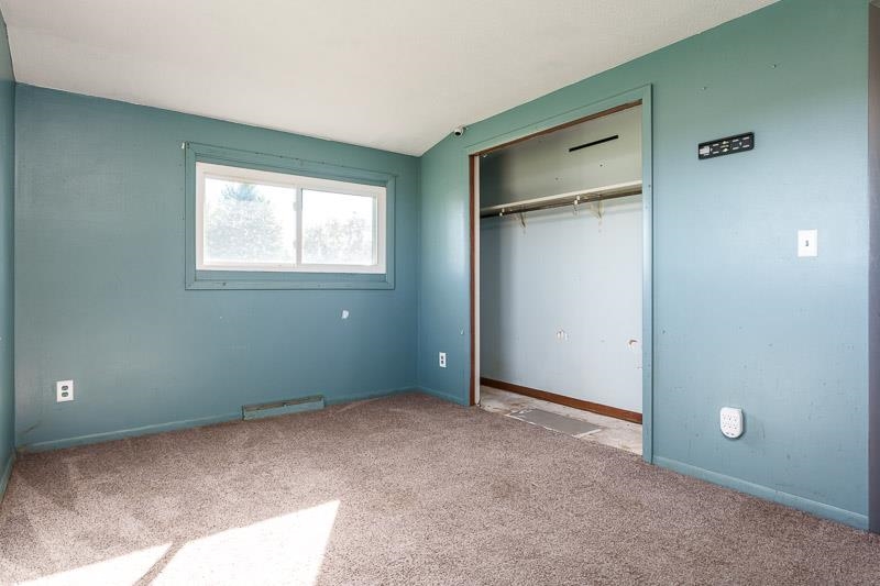 20110 Grade School Road Caledonia, IL 61011 - Photo 22 of 39 a view of an empty room with a window