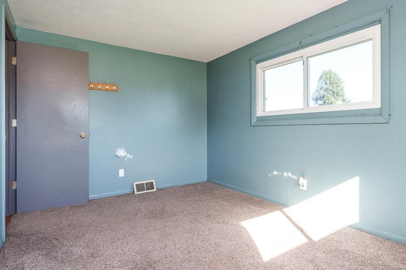 20110 Grade School Road Caledonia, IL 61011 - Photo 23 of 39 a view of an empty room with a window