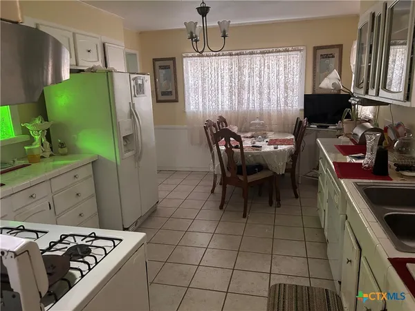 a dining room with furniture and a window
