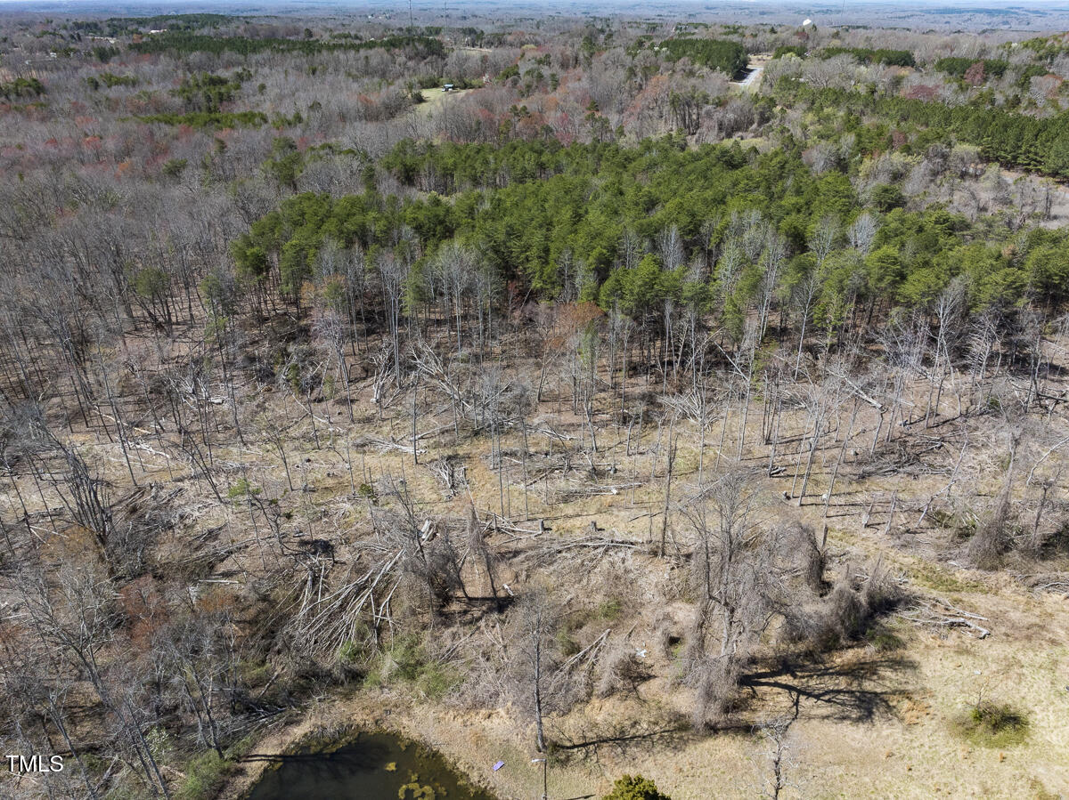 Lot 6 Goodman Road Pelham, NC 27311 - Photo 40 of 42 a view of a yard with trees in the background