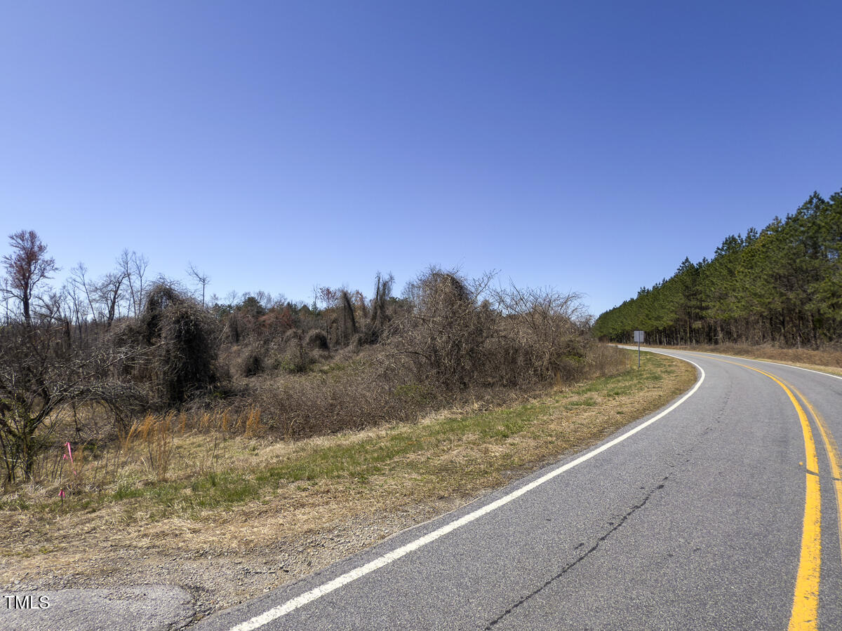 Lot 6 Goodman Road Pelham, NC 27311 - Photo 10 of 42 a view of a dry yard with wooden fence