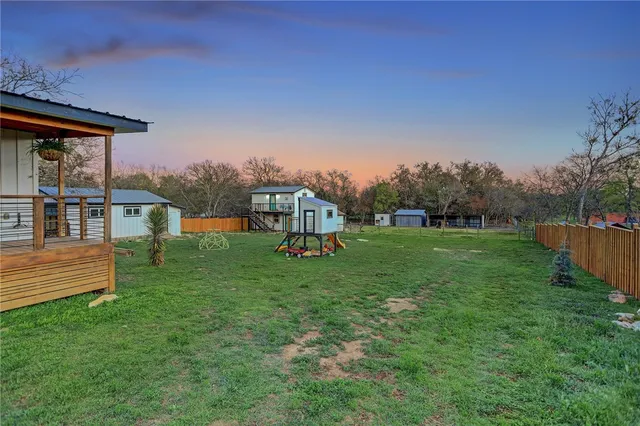 a view of a house with a yard porch and sitting area