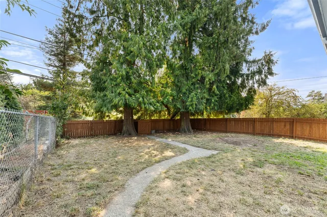 a view of a house with a yard and plants