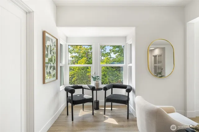 a view of a livingroom with furniture and a window