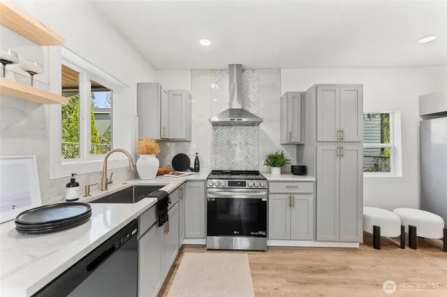 a kitchen with a sink stove and refrigerator