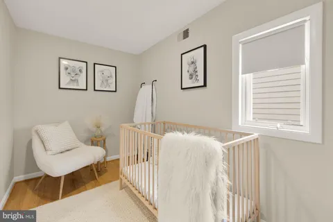 a bedroom with a bed and a chair