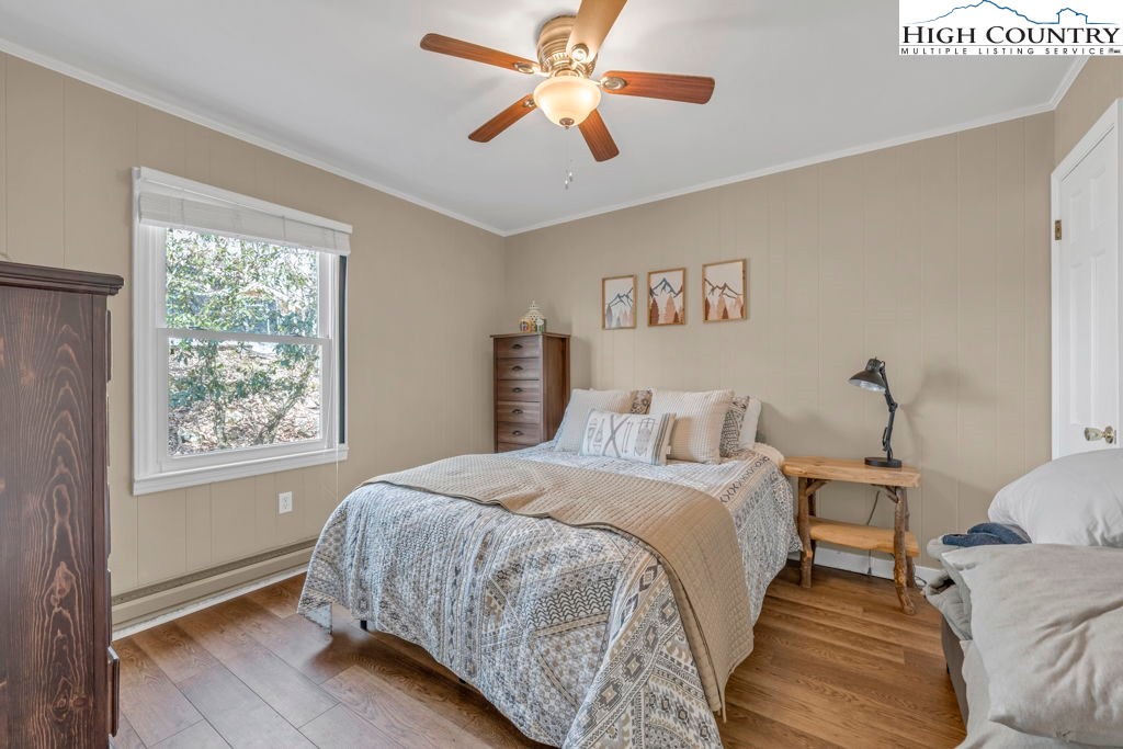 837 Pine Ridge Road Beech Mountain, NC 28604 - Photo 6 of 21 a bedroom with a bed and a window