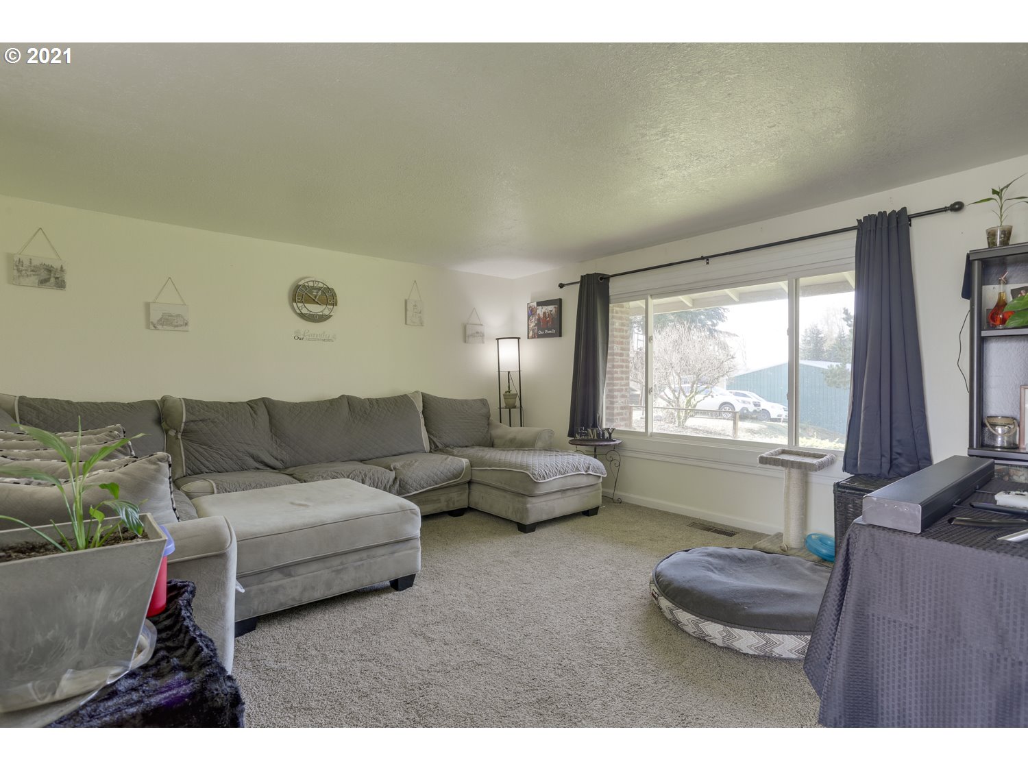 26440 Northwest Reeder Road Portland, OR 97231 - Photo 2 of 31 a living room with furniture and a large window