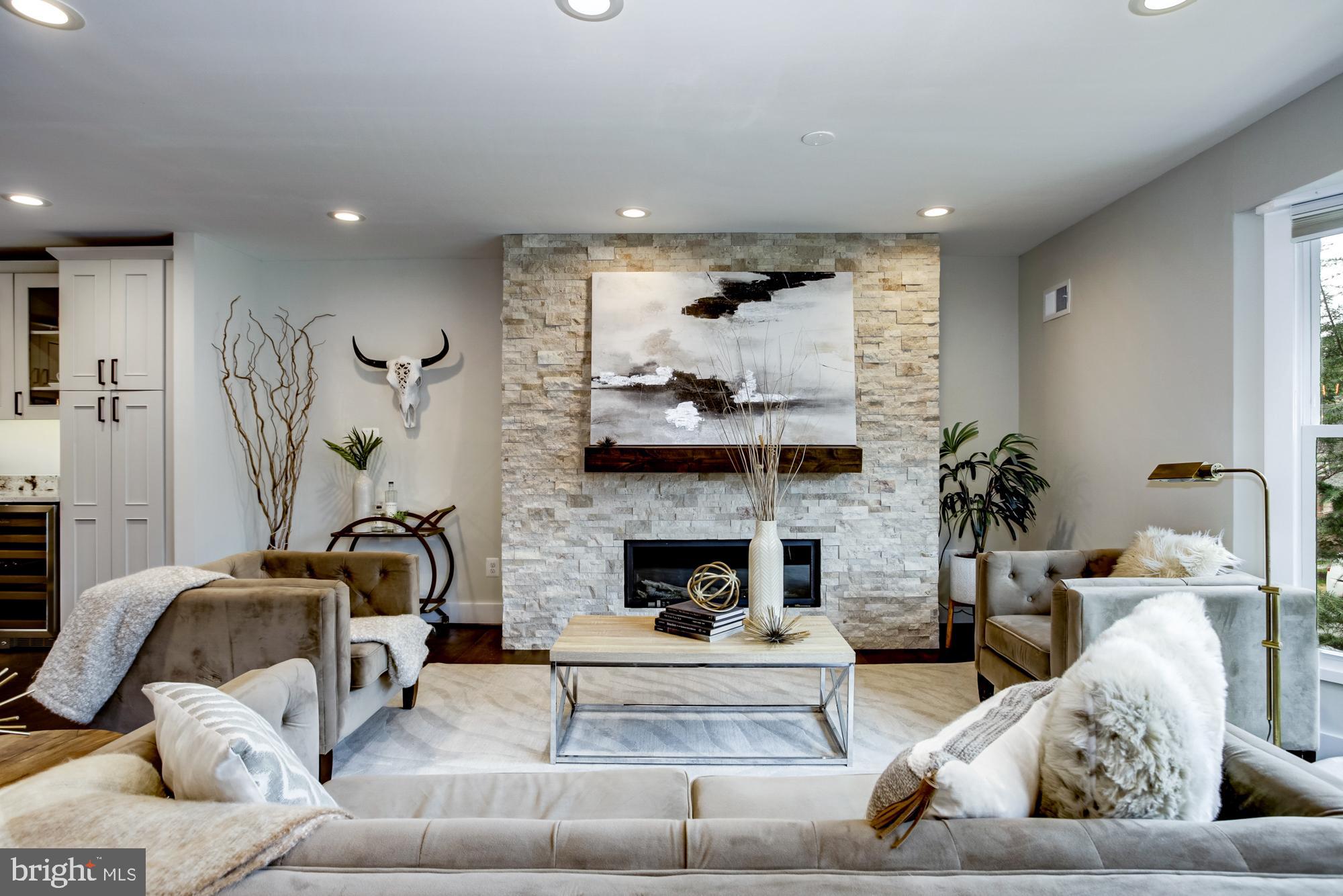 5507 Durbin Road Bethesda, MD 20814 - Photo 5 of 50 Modern stone gas fireplace in main family room