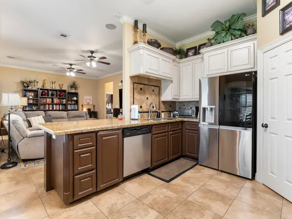 a kitchen with cabinets and window