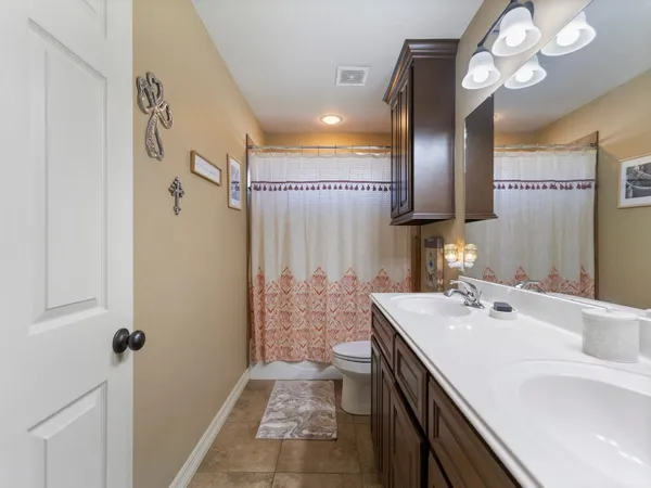 a bathroom with a sink a vanity and a mirror